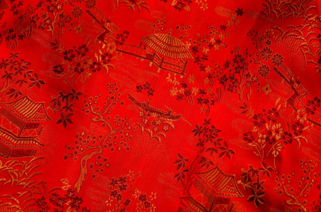 a red pashmina fabric with a pattern