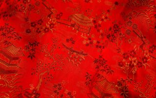 a red pashmina fabric with a pattern